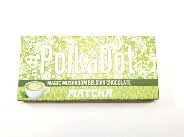 A PolkaDot Matcha Chocolate Bar wrapped in green packaging, showcasing a rich blend of matcha and Belgian chocolate with a smooth, creamy texture